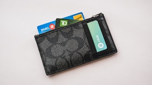 a wallet with credit cards sticking out of it