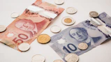 a bunch of money sitting on top of a table