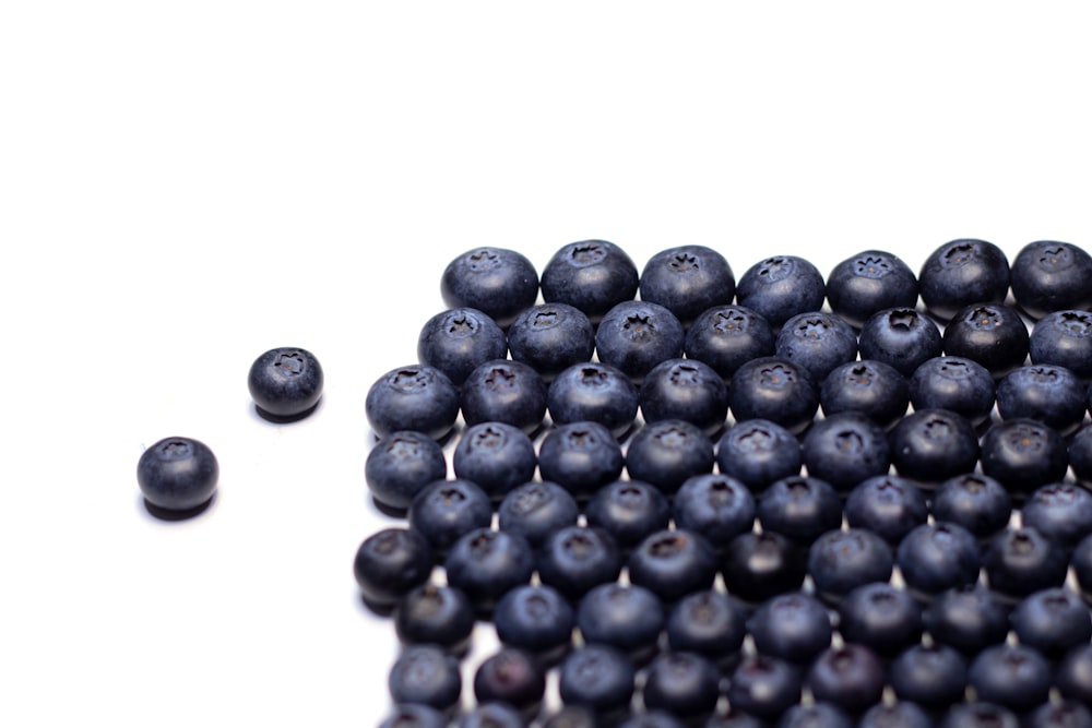 a pile of blueberries sitting next to each other