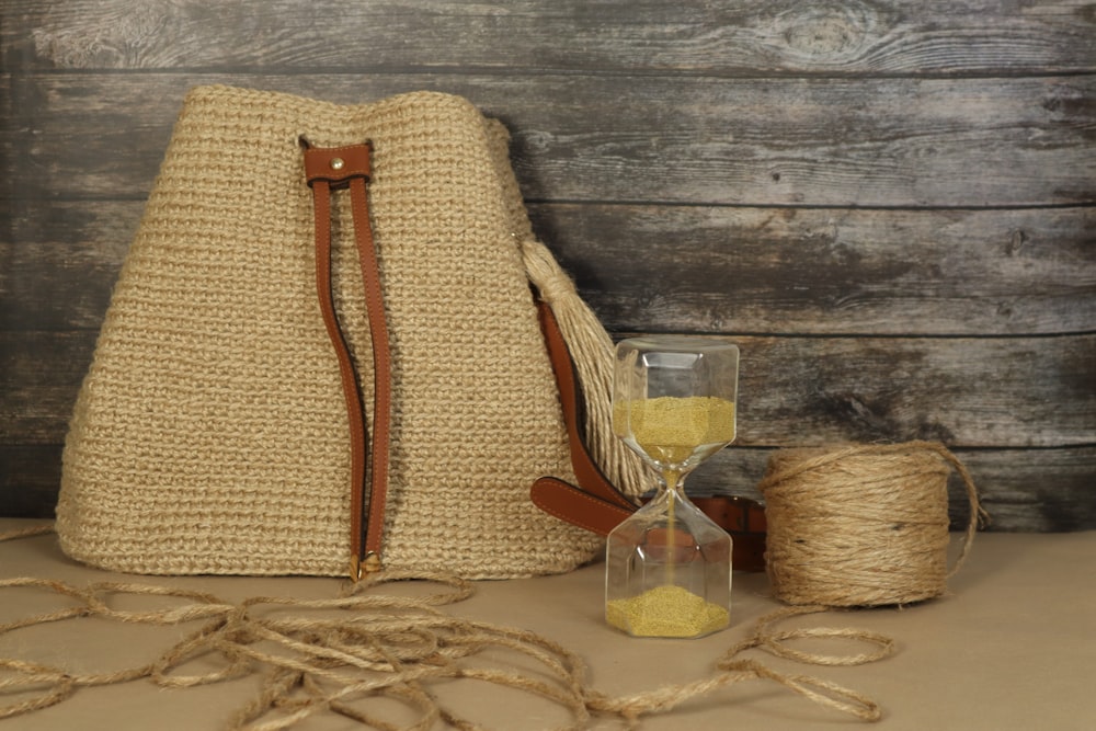 a jute bag with a glass of wine and twine of twine