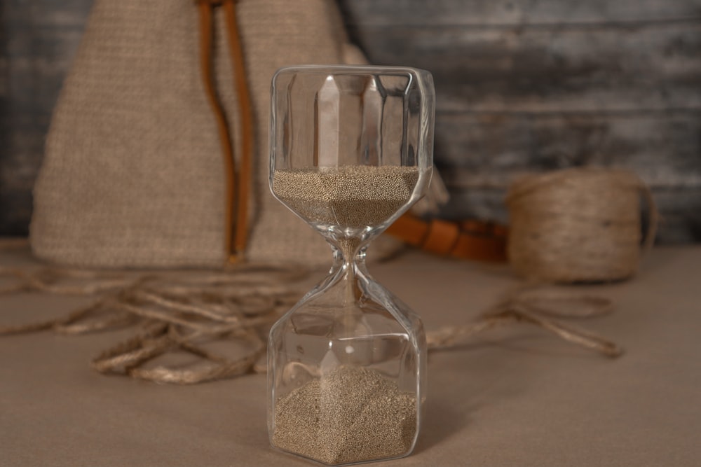 a sand clock sitting on top of a table