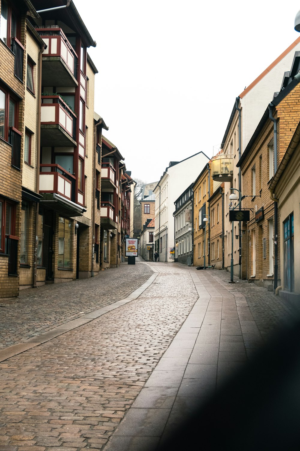 a cobblestone street in a european city