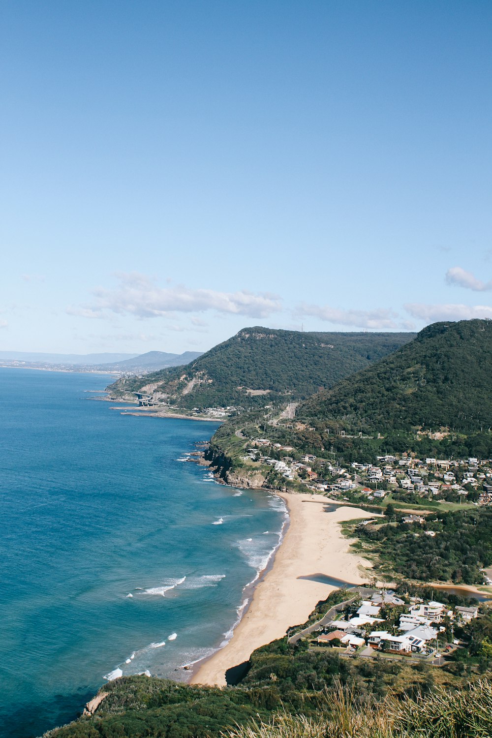 a scenic view of a beach and the ocean