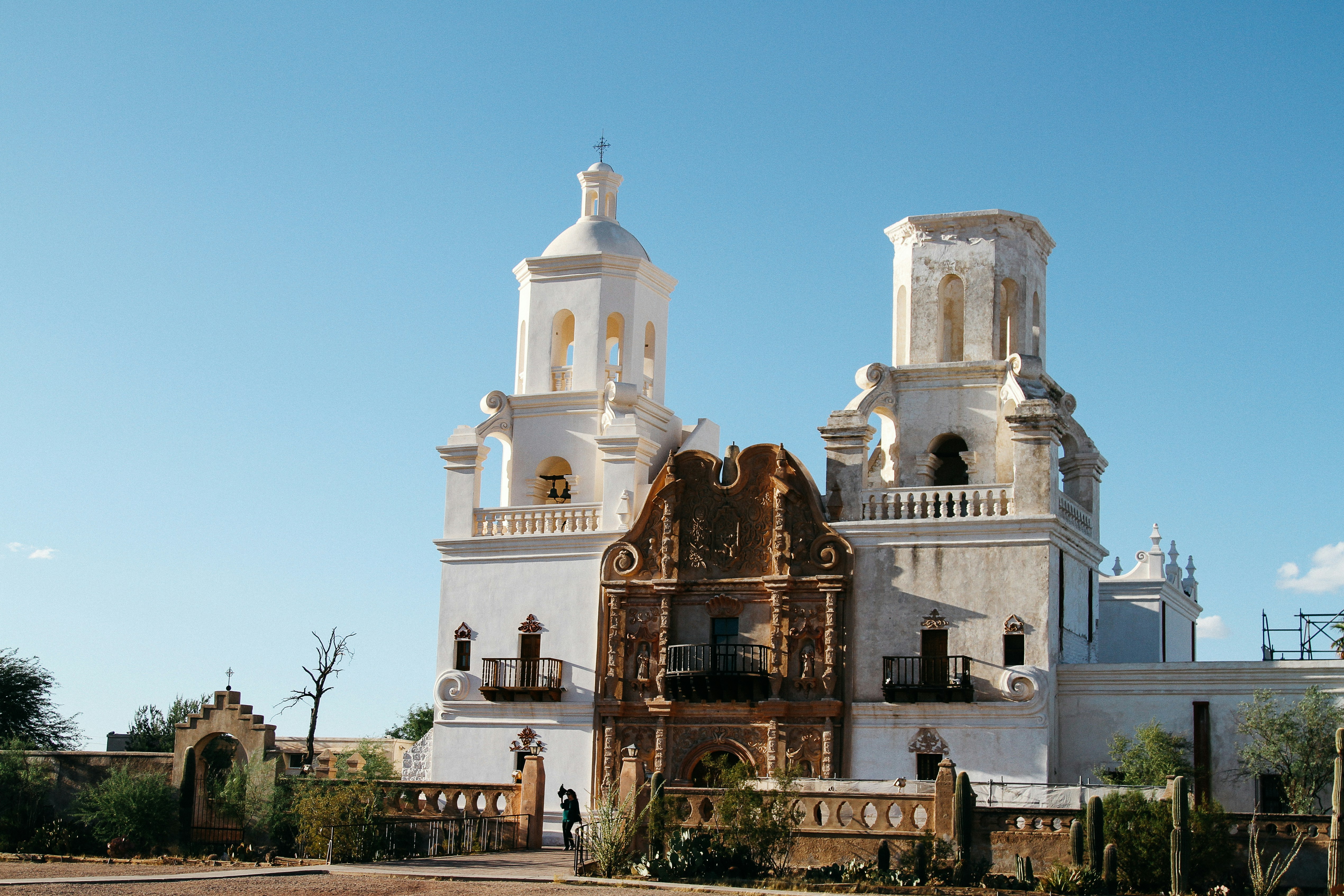 a large white building with a clock on it's side