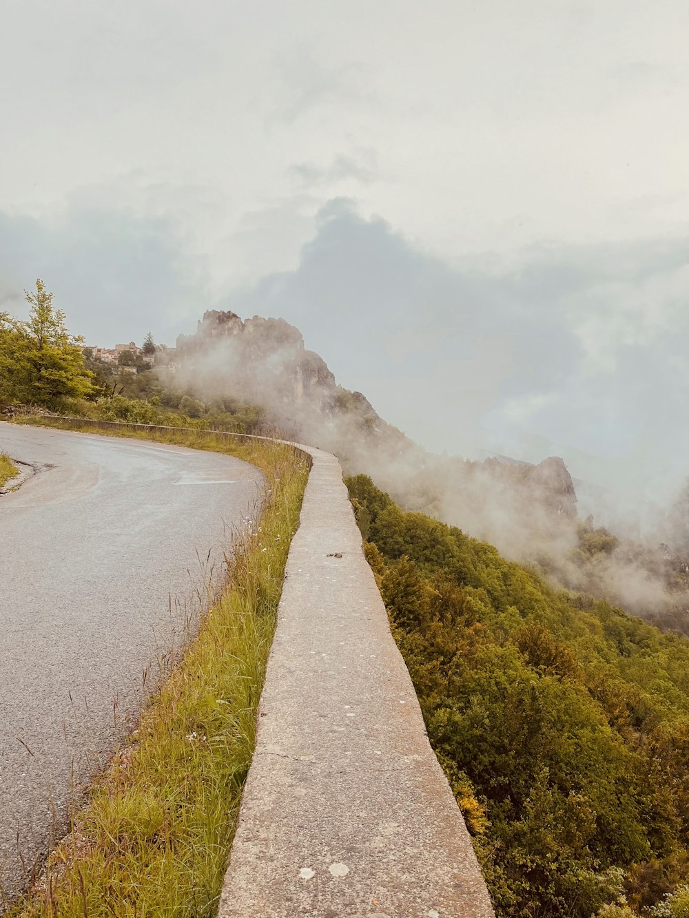 a paved road on the side of a mountain