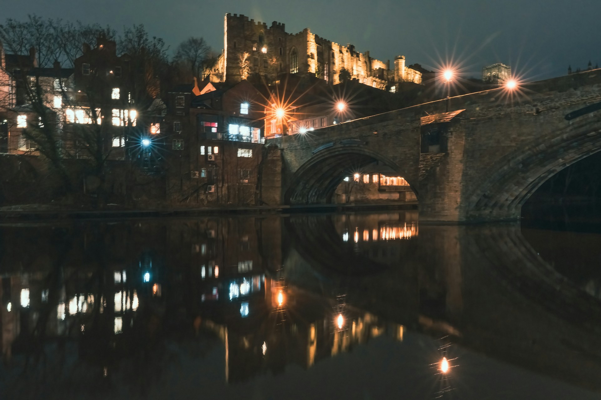 a bridge over a body of water at night
