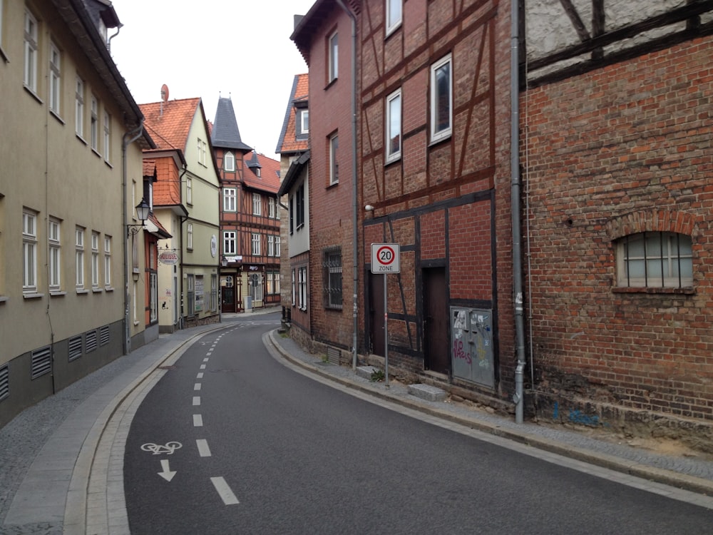 an empty street with a bike lane in the middle of it