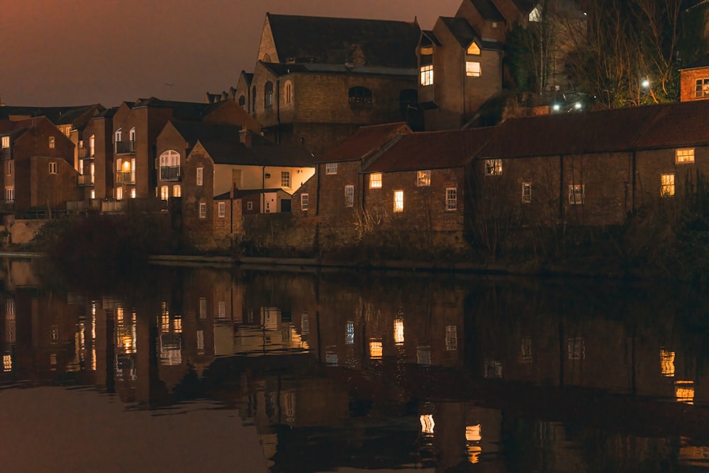 a row of houses next to a body of water