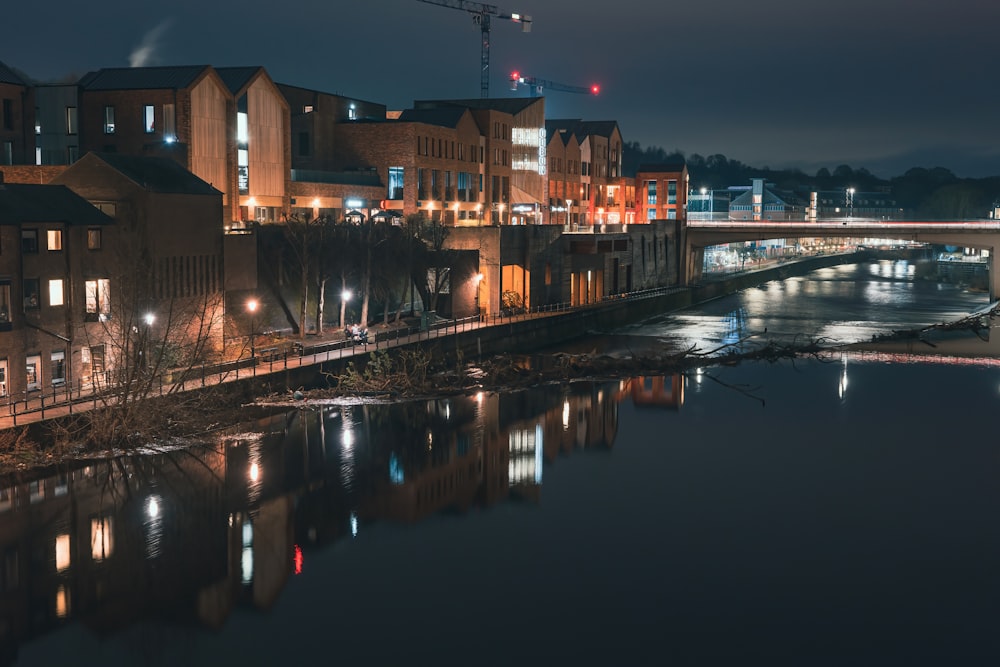 a river running through a city at night