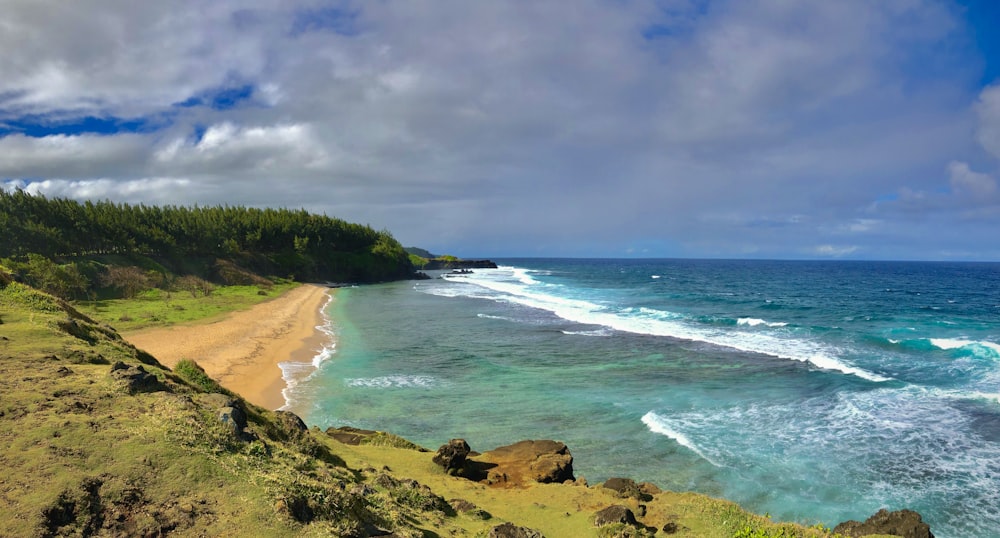 a view of the ocean from the top of a hill