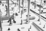 a bunch of screws and screws on a table