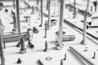 a bunch of screws and screws on a table