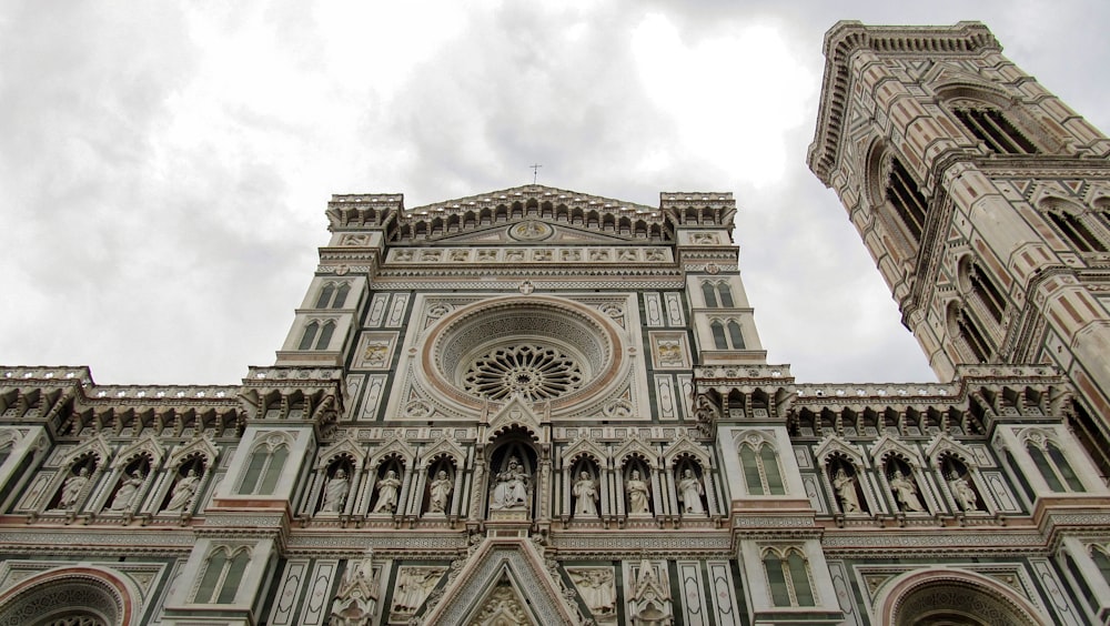 a very tall cathedral with a clock on it's side