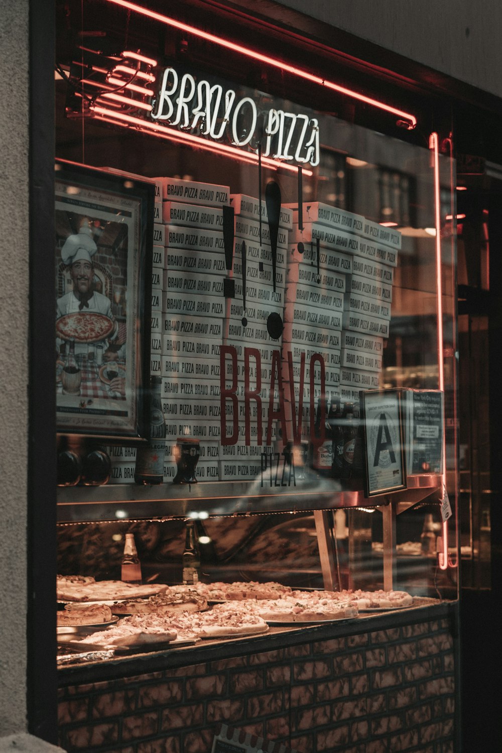 a window display of a pizza restaurant