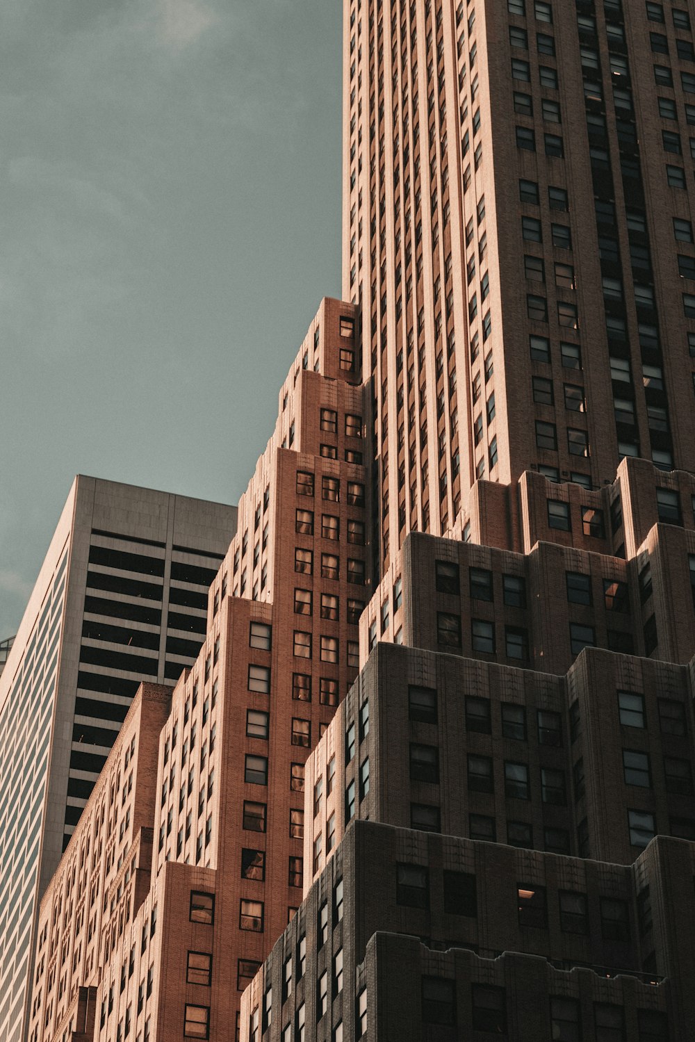 a very tall building towering over a city