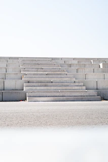 a man riding a skateboard down the side of a cement wall