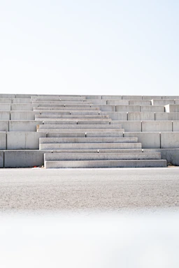 a man riding a skateboard down the side of a cement wall