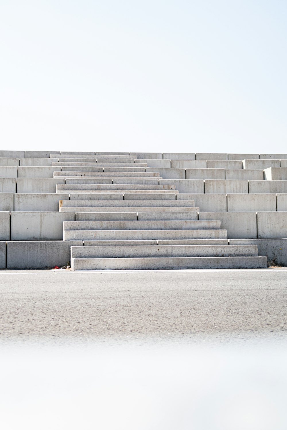 a man riding a skateboard down the side of a cement wall