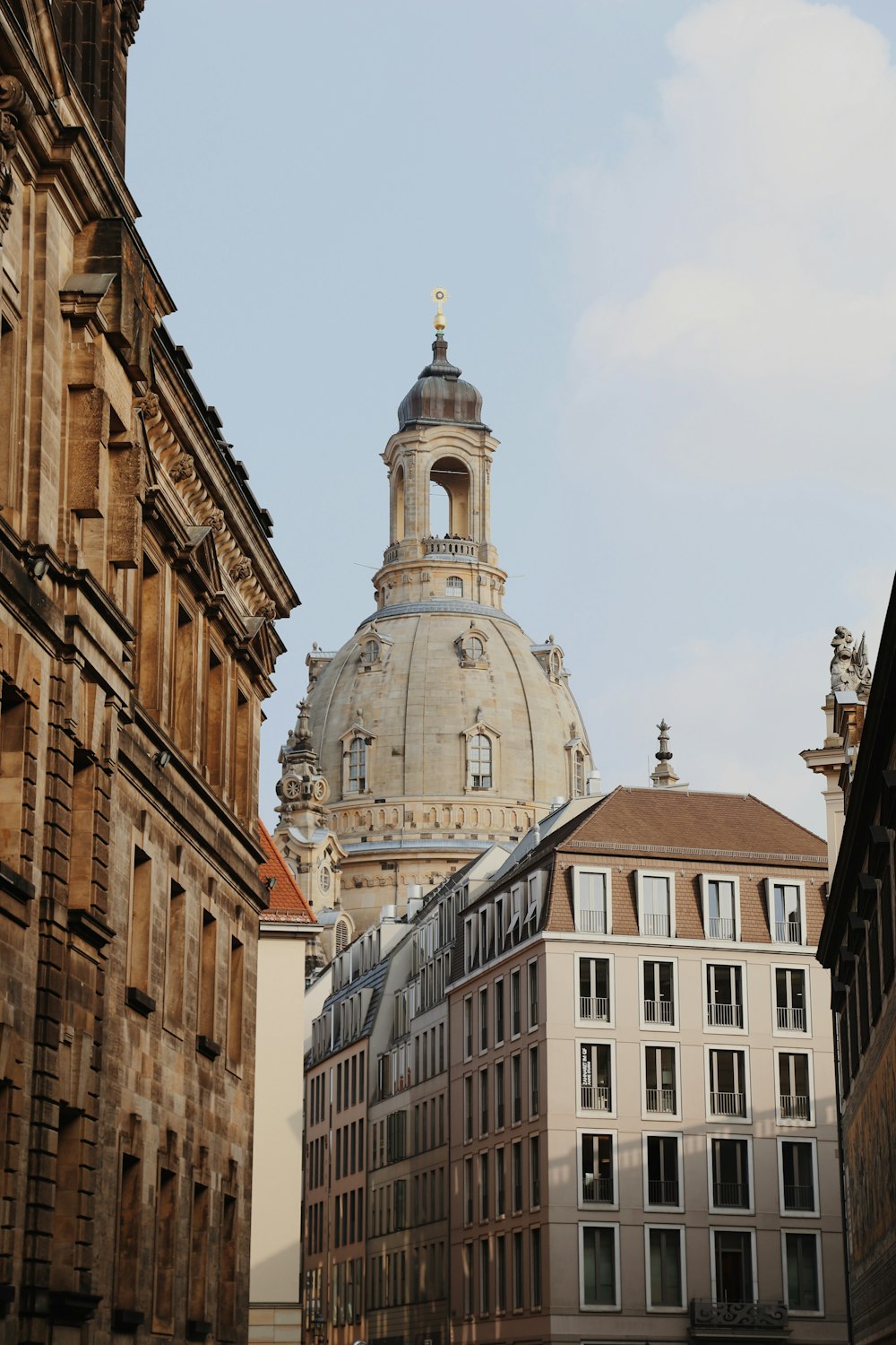 a building with a dome in the middle of a city