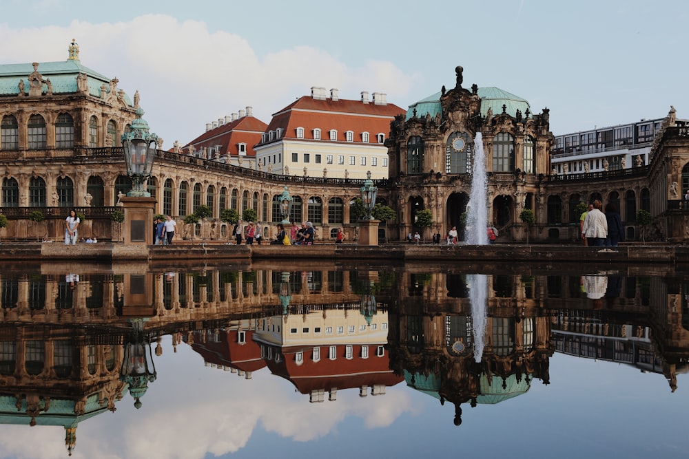 a large building with a fountain in front of it