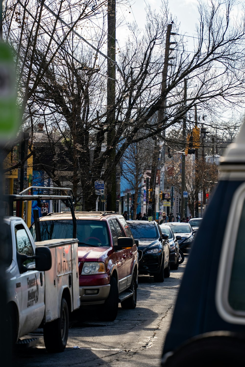 a line of parked cars on a city street