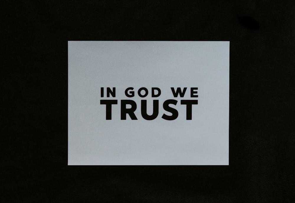 a piece of paper with the words in god we trust on it