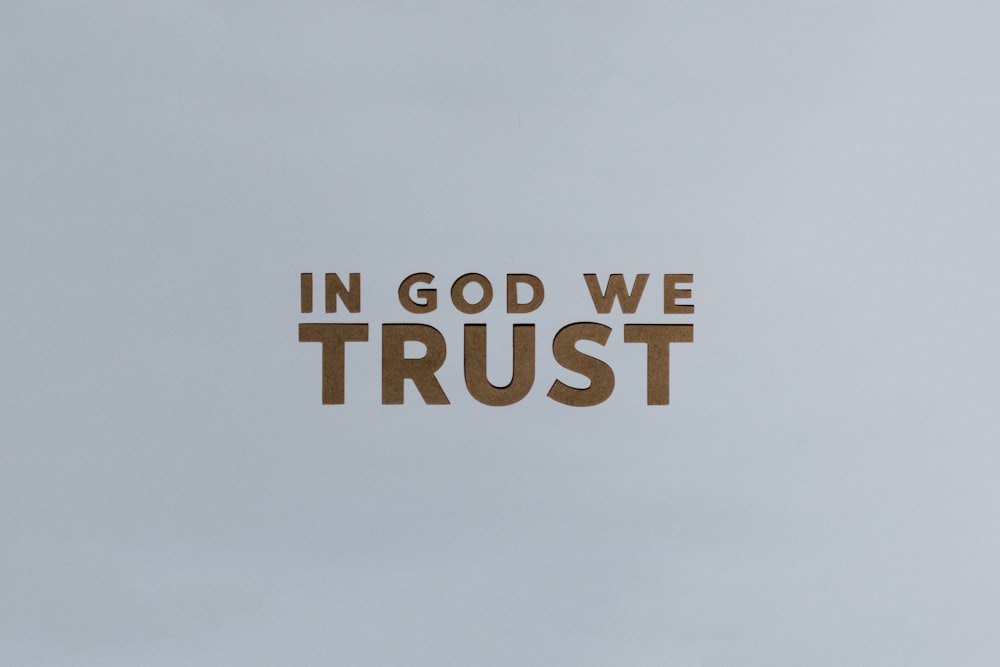 the words in god we trust are cut out of wood