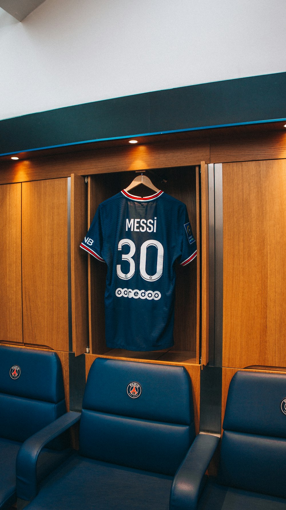 a jersey hangs on a locker room wall