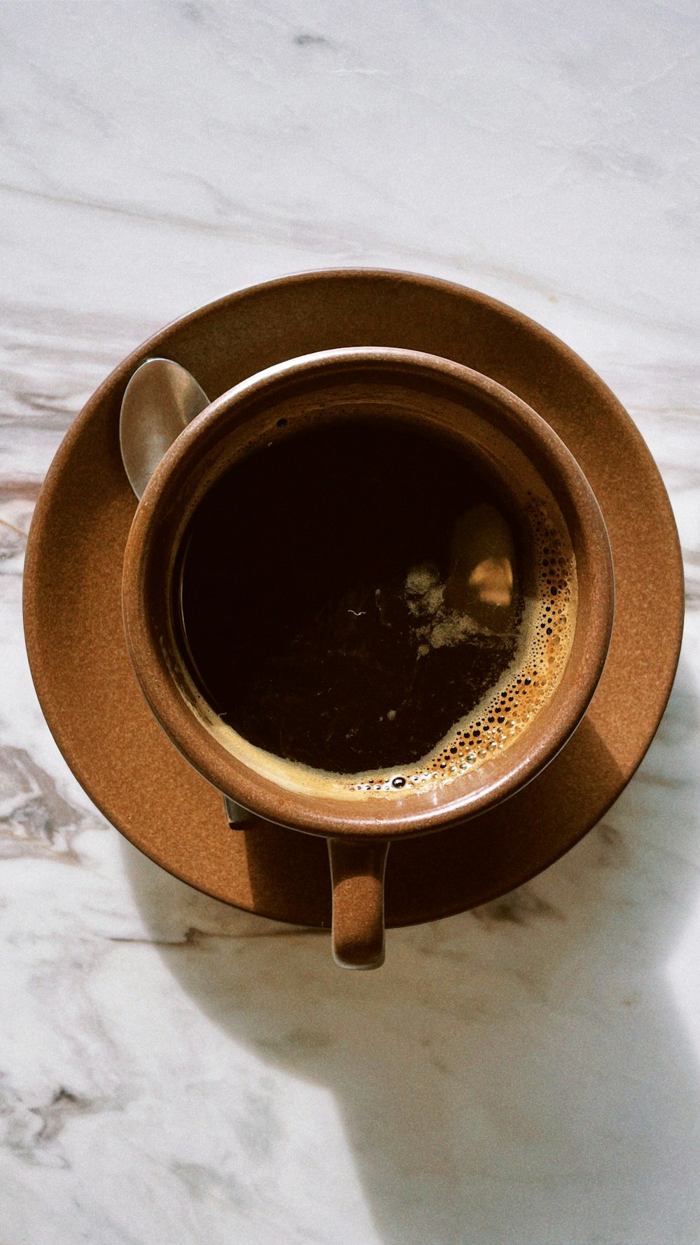 a cup of coffee sitting on top of a saucer