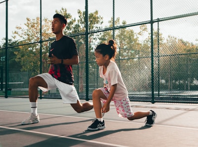 a man and a woman playing tennis on a court