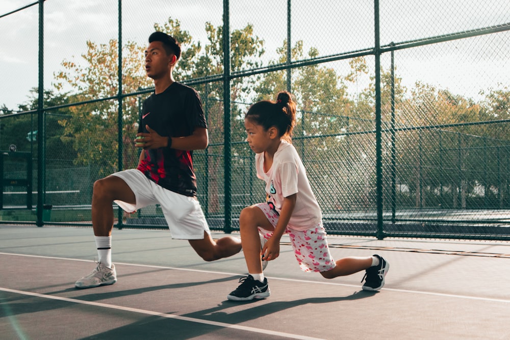 a man and a woman playing tennis on a court