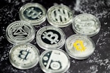 a pile of bitcoins sitting on top of a table