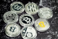 a pile of bitcoins sitting on top of a table
