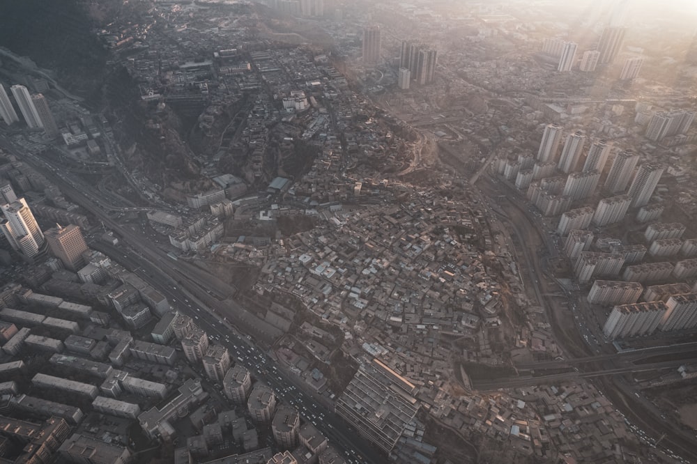 an aerial view of a city with lots of tall buildings