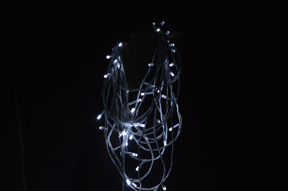 a string of white lights on a black background