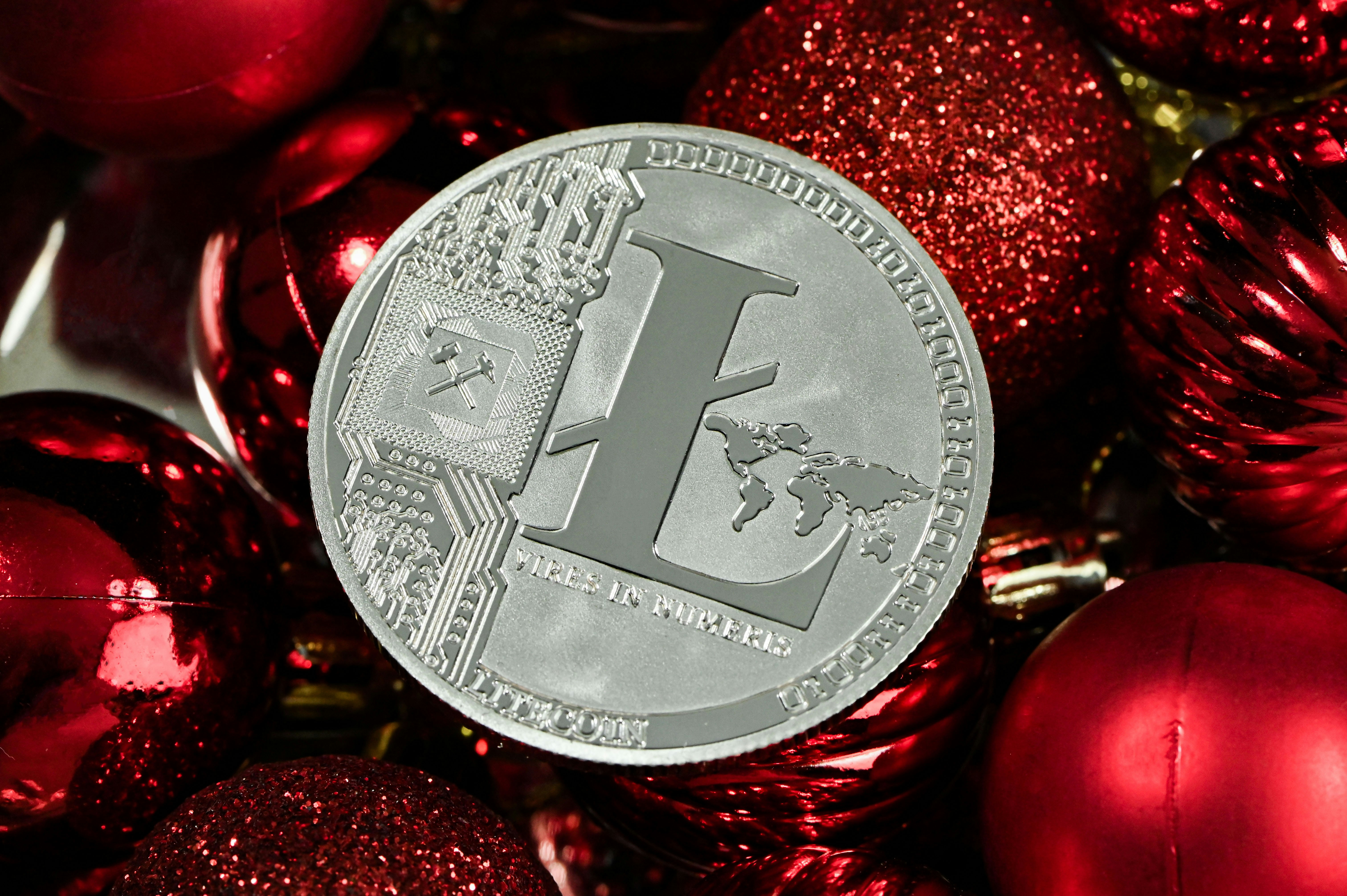 A silver Litecoin placed on the red balls