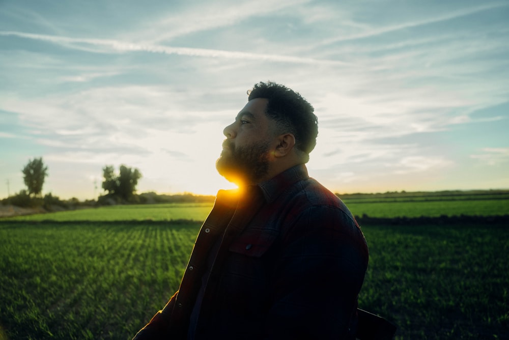 a man standing in the middle of a field