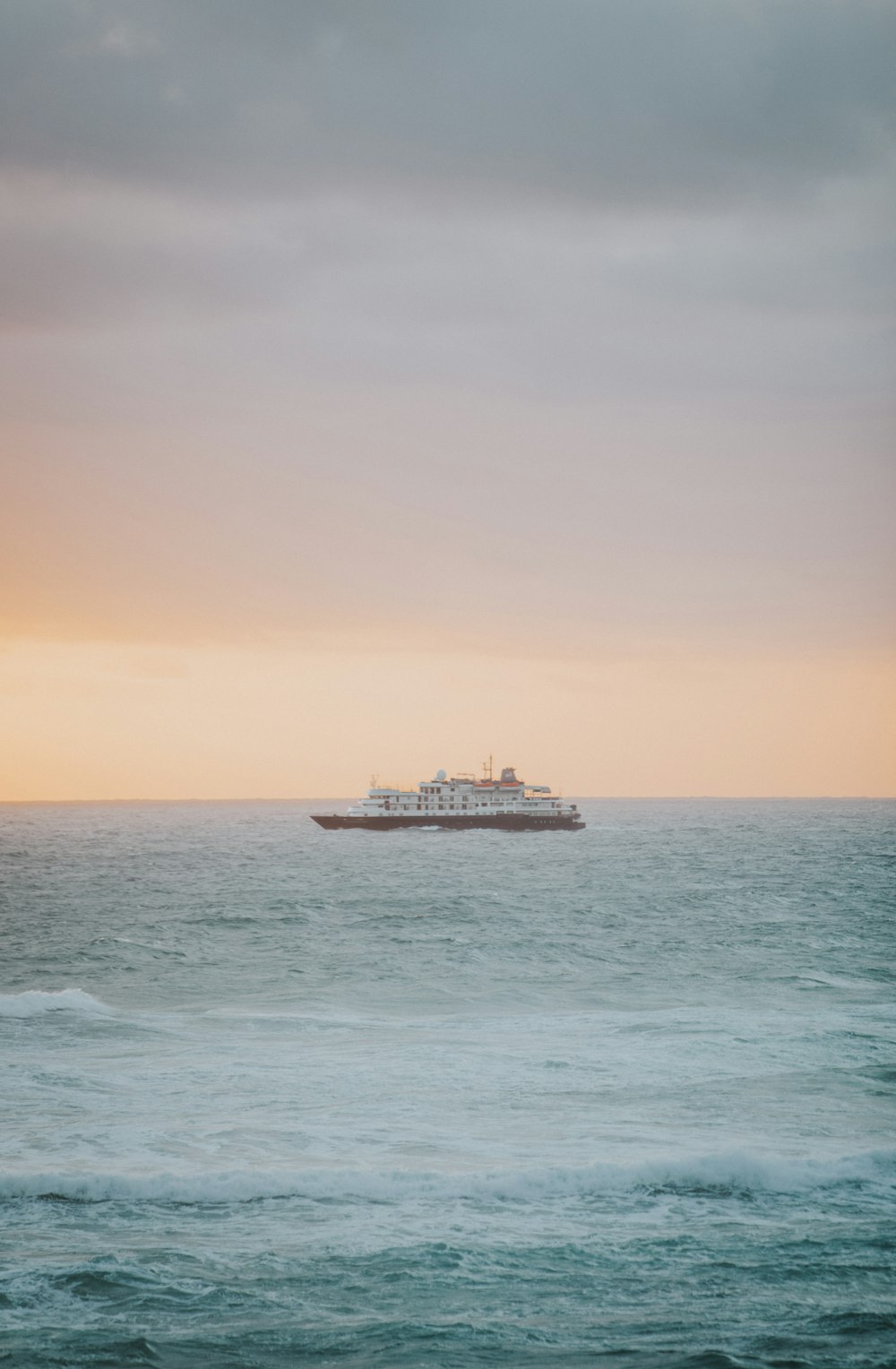 a large boat floating on top of a large body of water