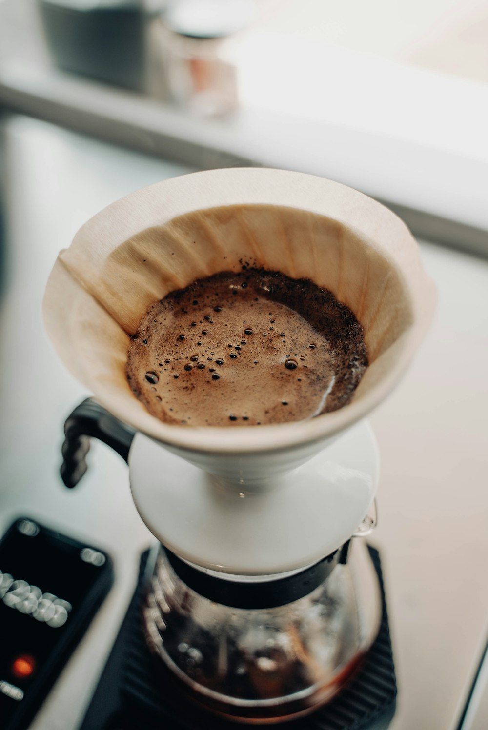 a cup of coffee sitting on top of a stove