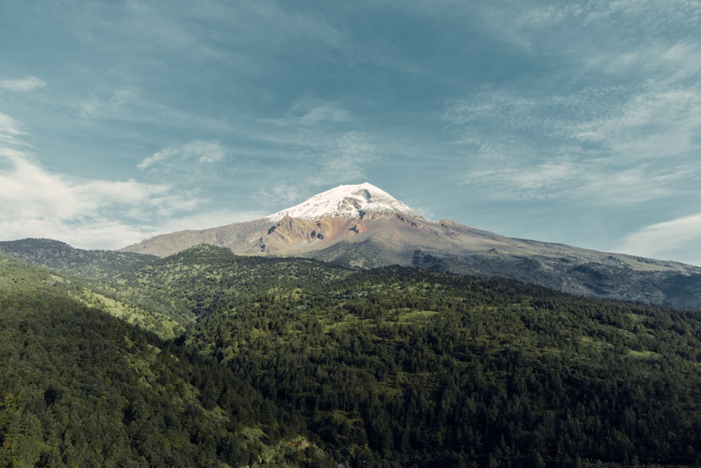 a mountain with a snow capped peak in the distance