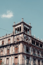 a tall building with a clock on the top of it