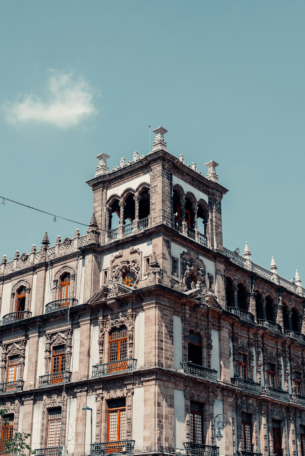 a tall building with a clock on the top of it