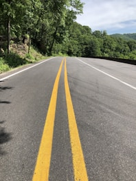 a road with a yellow line on the side of it