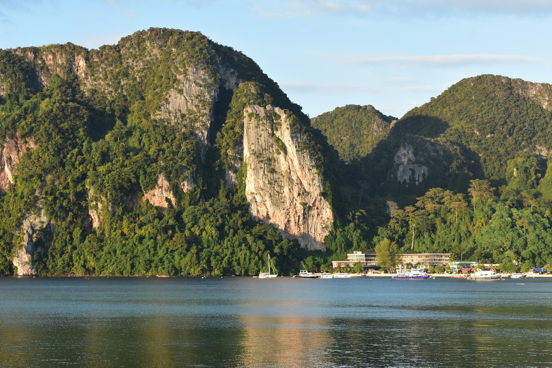 a body of water with mountains in the background