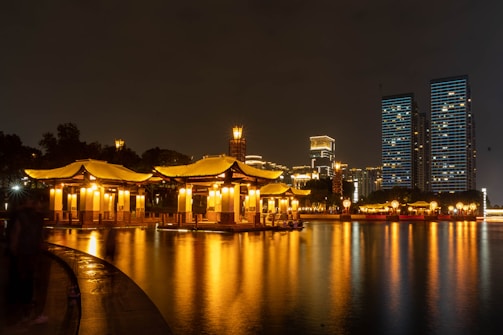a large body of water with a building in the background