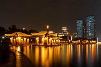 a large body of water with a building in the background