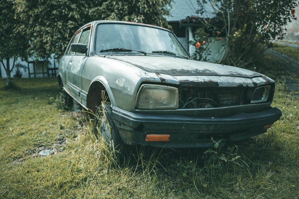 a car that is sitting in the grass