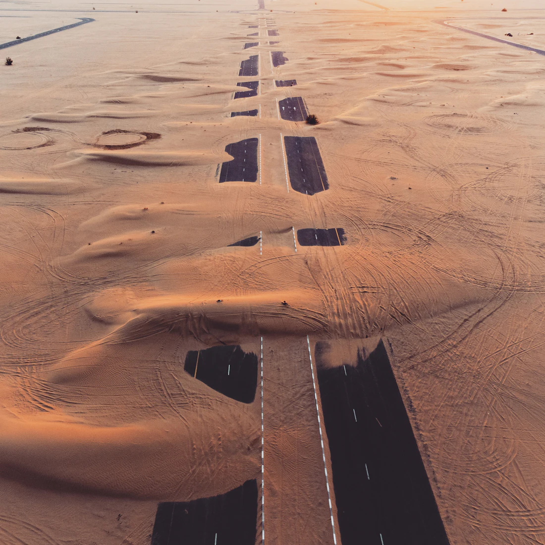 Aerial view of a new road corridor crossing open desert land
