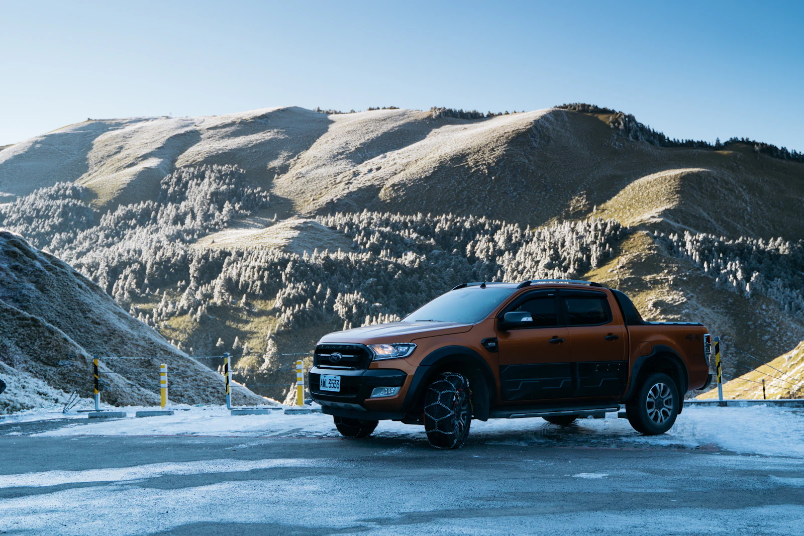 A car on a snowy mountain road