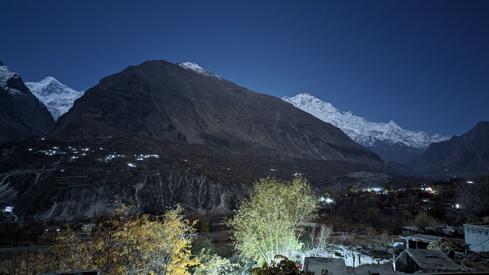 a view of a mountain range at night